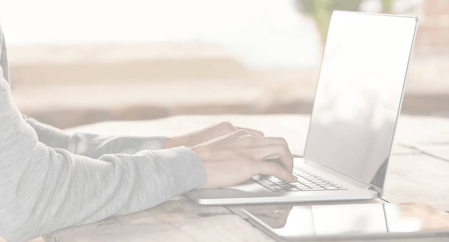 a person typing on a  macbook pro